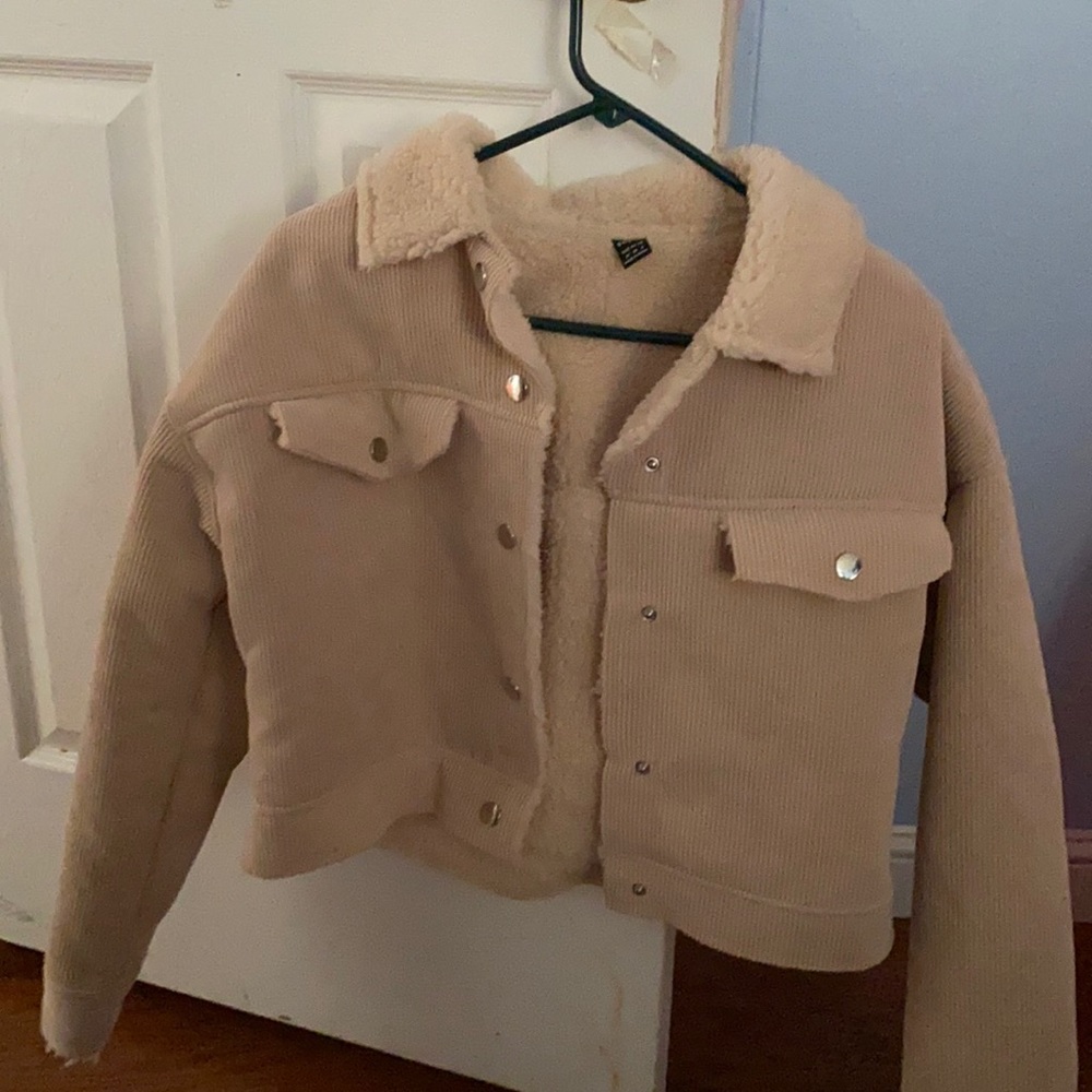 Tan jacket. Size medium